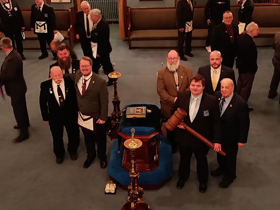 An image of Masons from Bellevue Lodge holding the “Traveling Gavel” for a local lodge’s annual inspection.