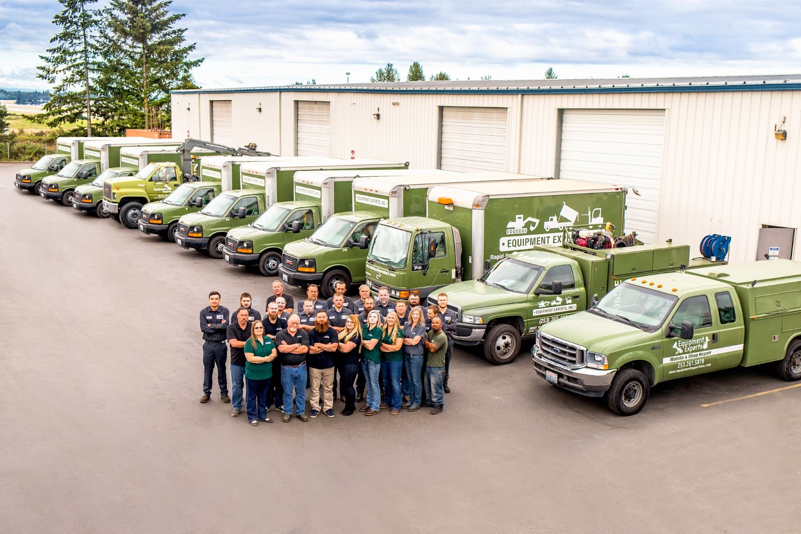 An aerial view of Equipment Experts, Inc.'s team and fleet of trucks