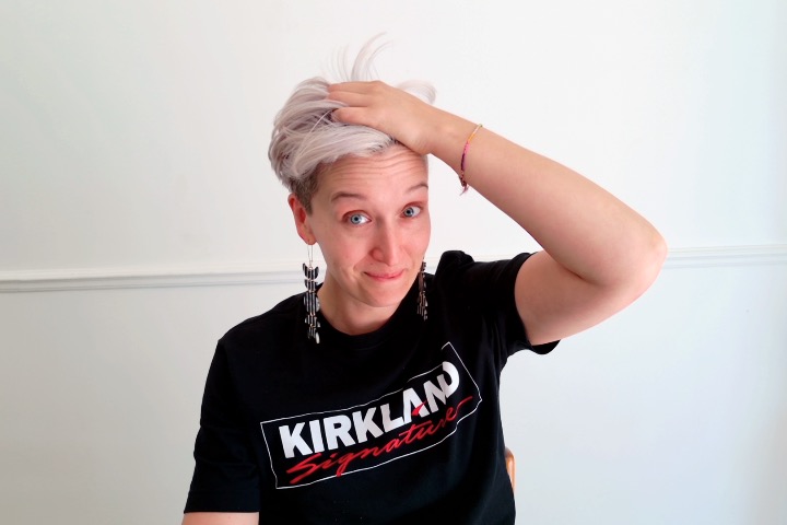 Tarzan grabs her white-grey hair in one hand. She wears a black Kirkland Signature t-shirt that she thinks is so cool, and wears a brand new pair of black-and-white striped earrings from Indi City that have 5 moons waxing and waning, a full moon in the middle. Please send compliments.