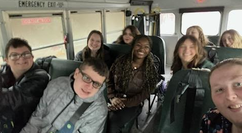 Photo of The LIFE Club Leadership Team on their way to the Summit on the bus