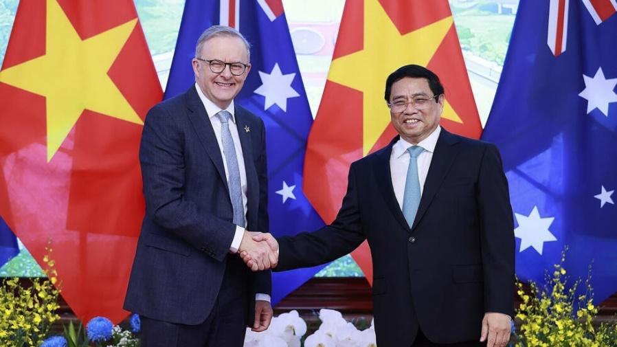 Australian Prime Minister Anthony Albanese, left, and Vietnamese Prime Minister Pham Minh Chinh, left, shake hands, ahead of their bilateral meeting in Hanoi, Vietnam on Sunday June 4, 2023. (Duong Gi