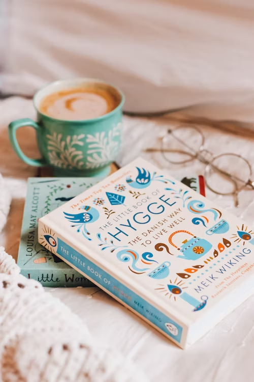 The Little Book of Hygge with glasses and a cup of tea