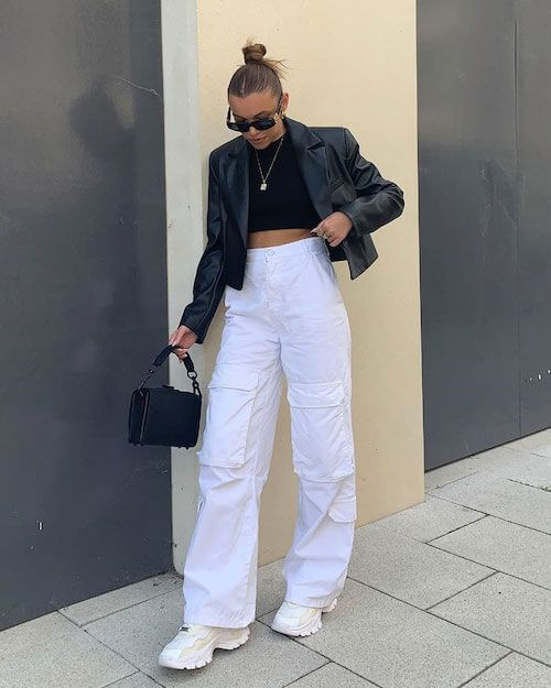 Picture of a girl rocking a white cargo pants and cool shades