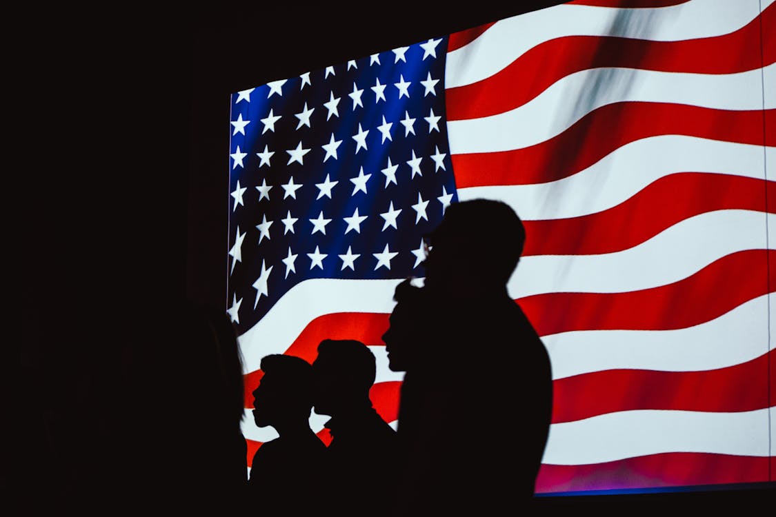 Free Silhouette of Four Person With Flag of United States Background Stock Photo
