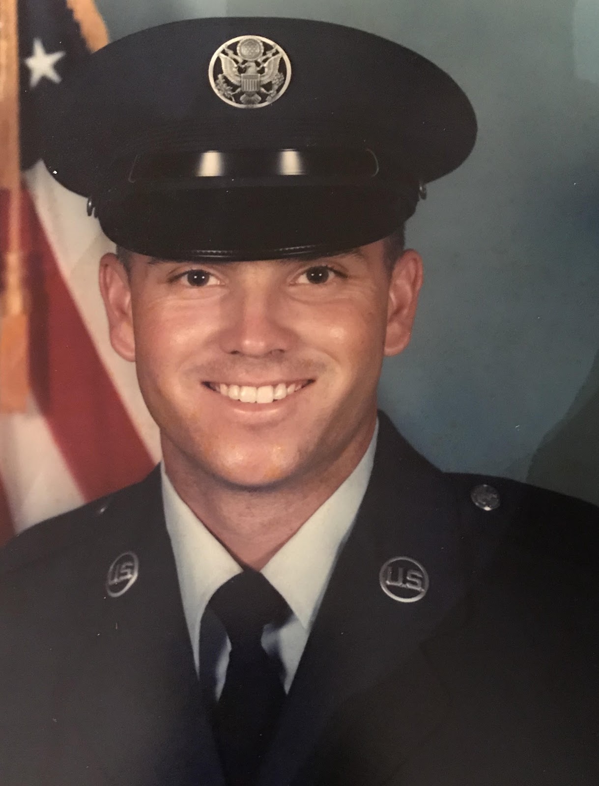 Dee Campbell smiles in uniform