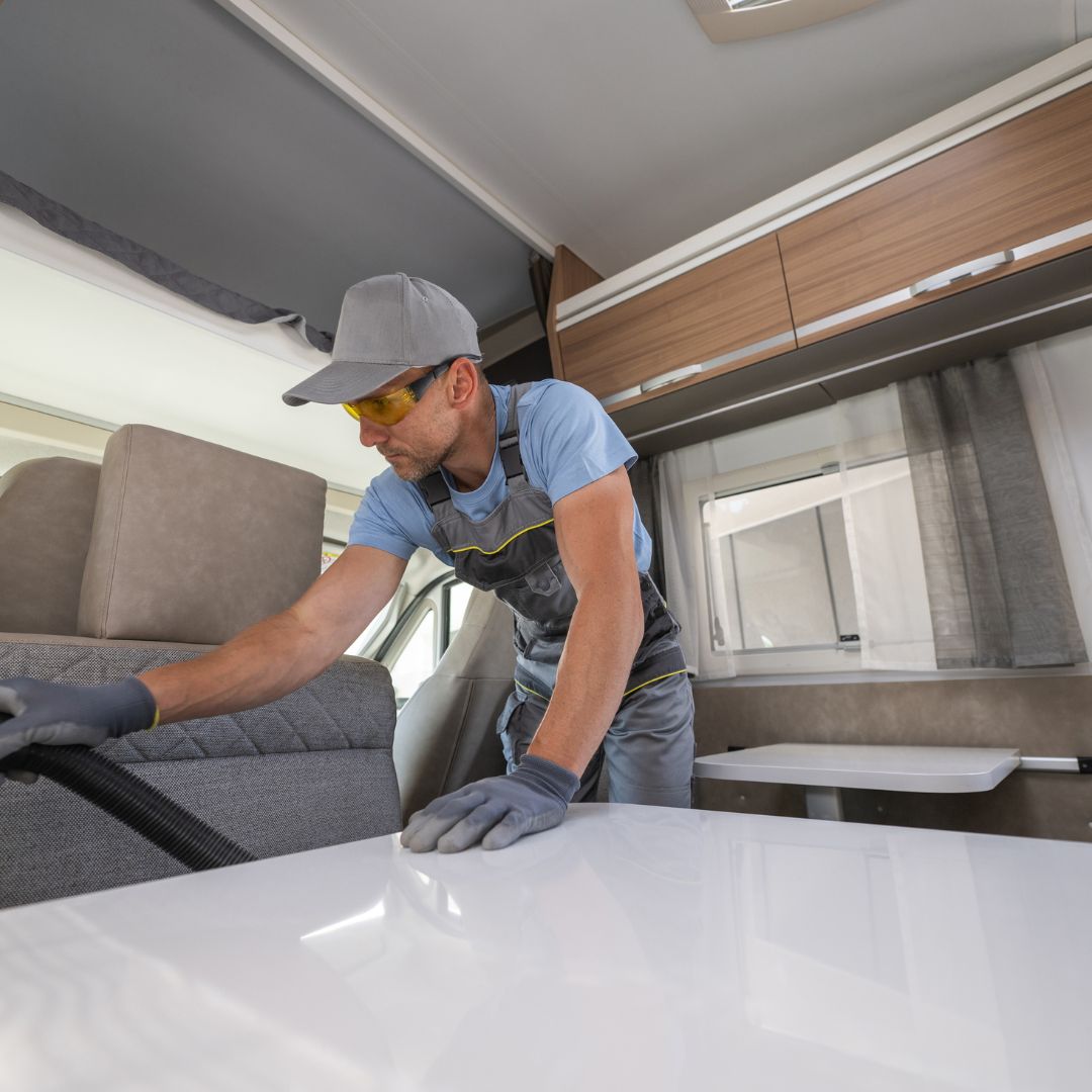 man cleaning rv