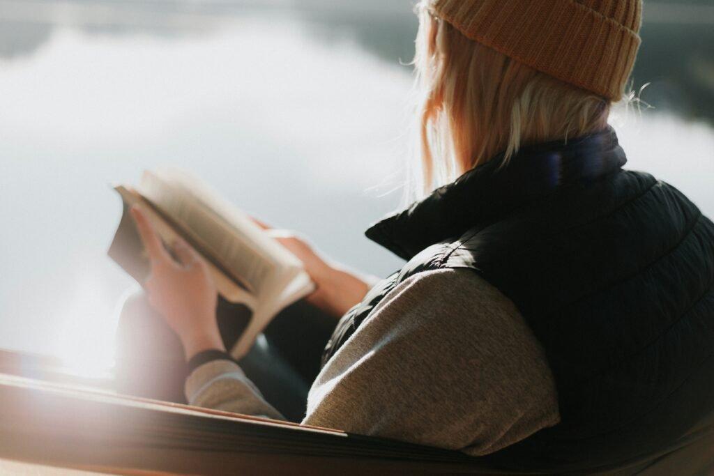 woman reading a book by the sea - Scientifically Proven Study Methods