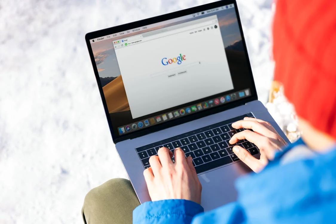 A person using Google on a Mac Pro 