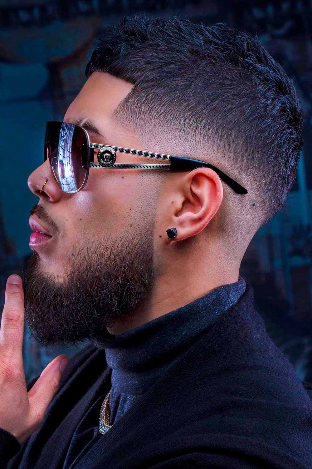 Side view of a guy rocking a mid length beard fade 