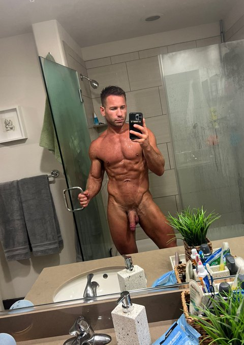 Sumner Blayne getting out of the shower and showing off his tanned wet muscled gay body and his flaccid dick