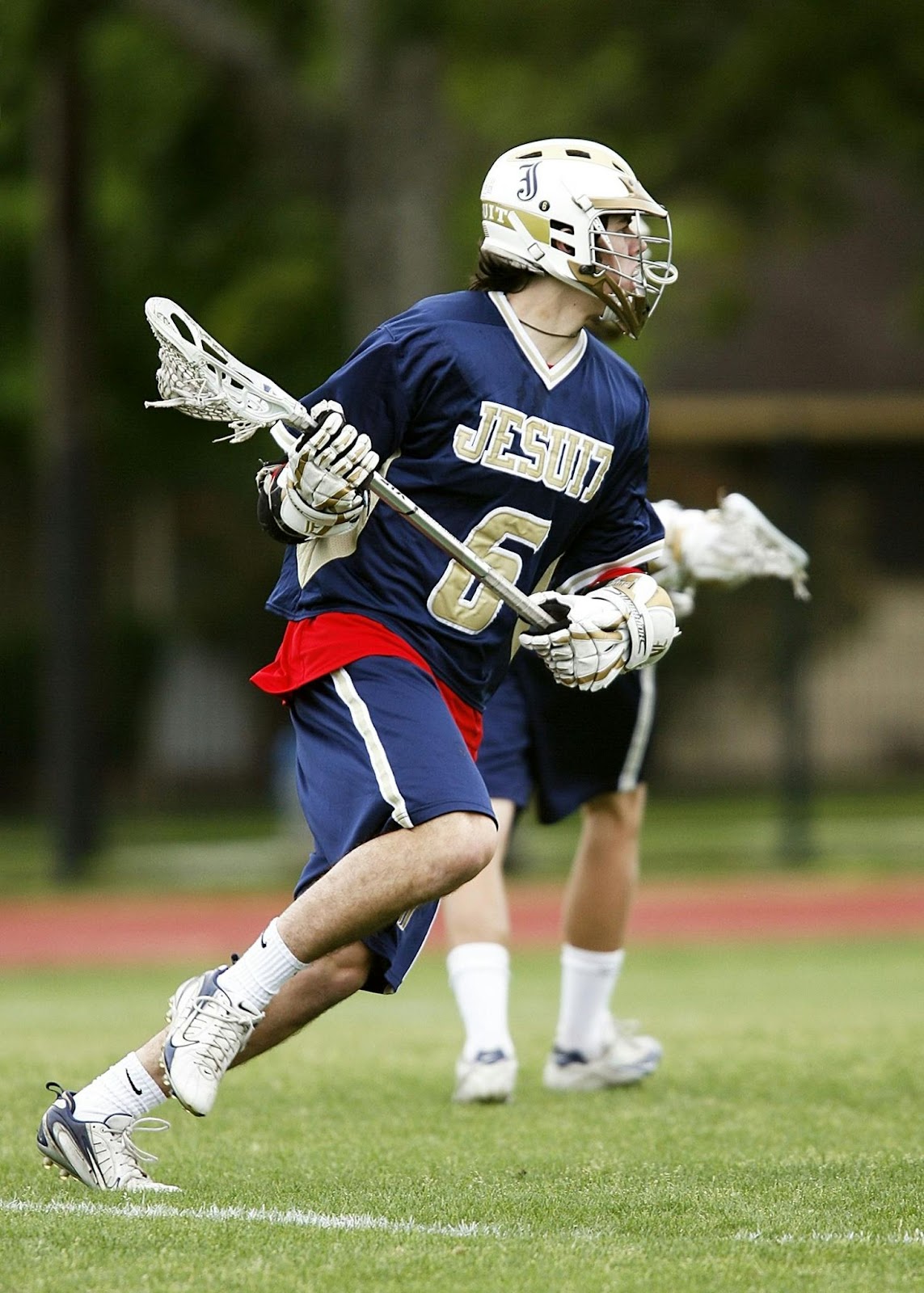 teenager playing lacrosse