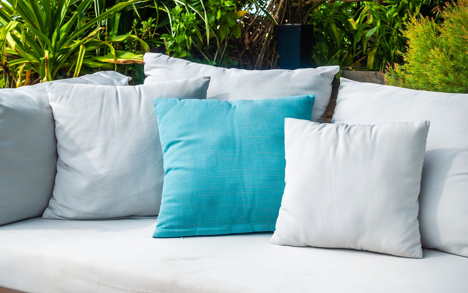 patio sofa with comfy gray and aqua outdoor throw pillows