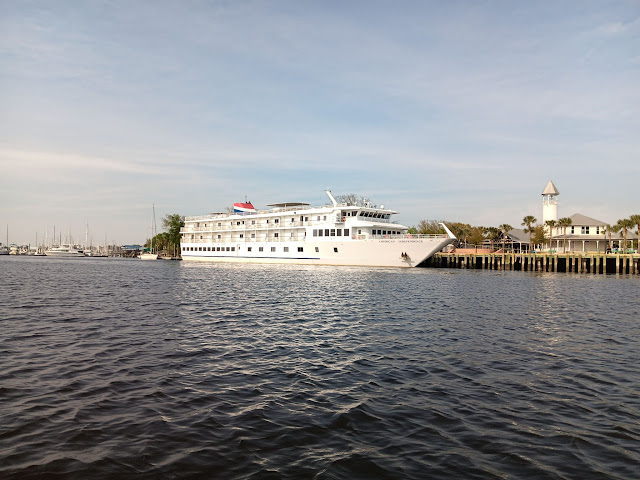 A large white cruise ship from American Cruise Lines.