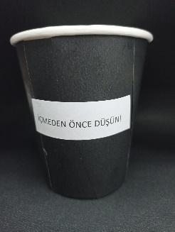 A black paper cup with a white label

Description automatically generated with medium confidence