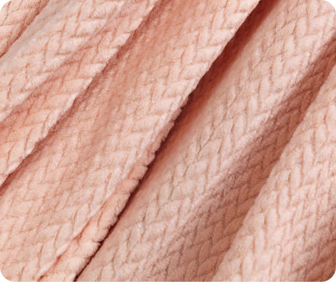 A close up of our pink Chevron Plush Throw in Blush.