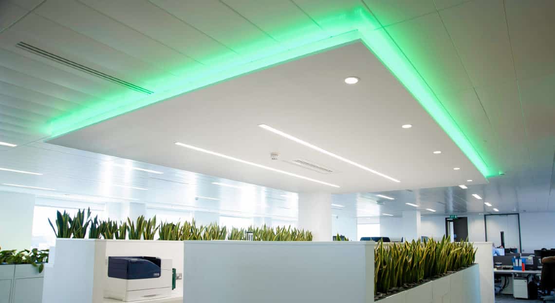 green lighting above a desk in an office