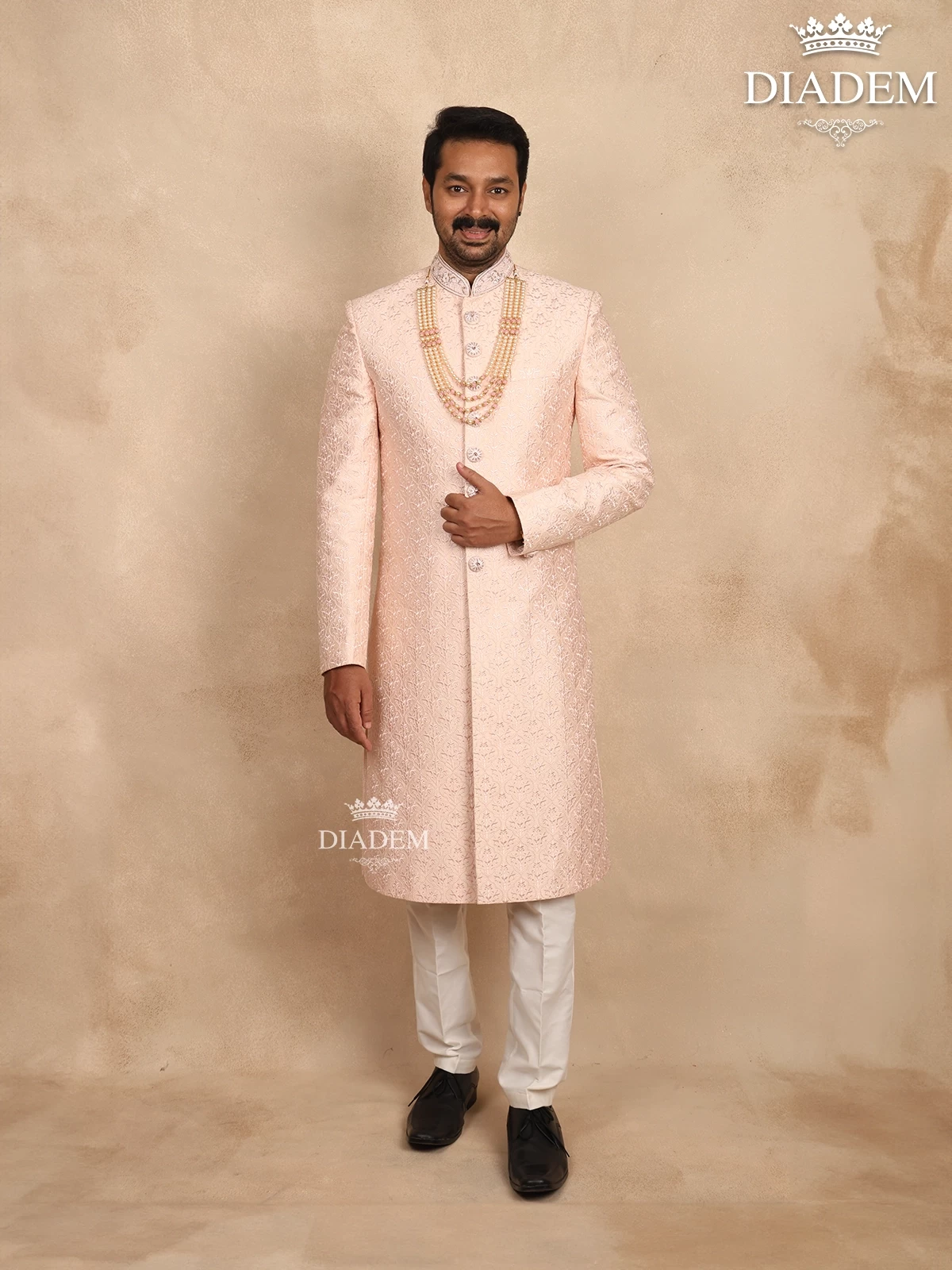Light Peach Raw Silk Sherwani Suit Adorned with Floral Threadwork Embroidery, Paired with Bead Mala