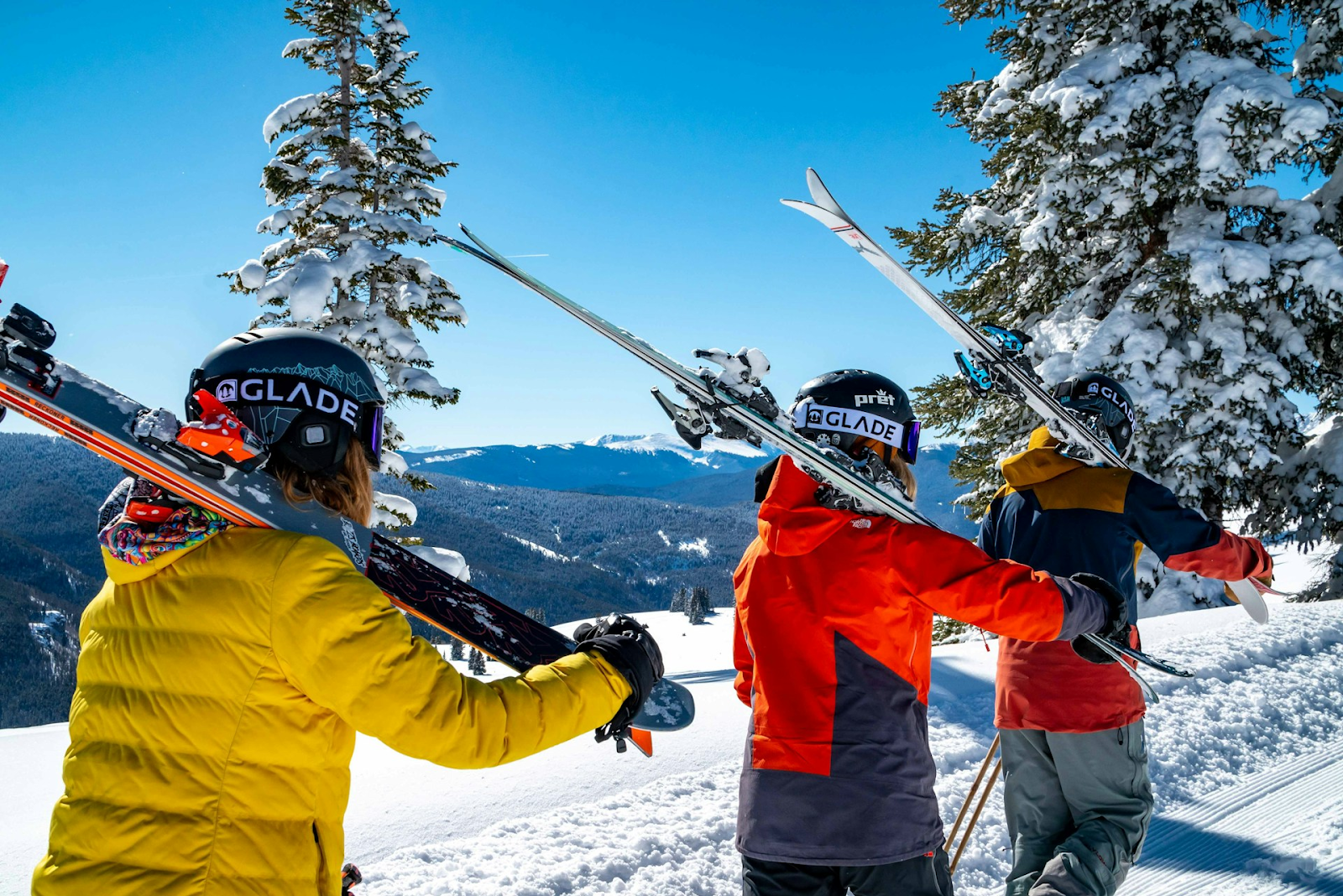 Three skiers walking