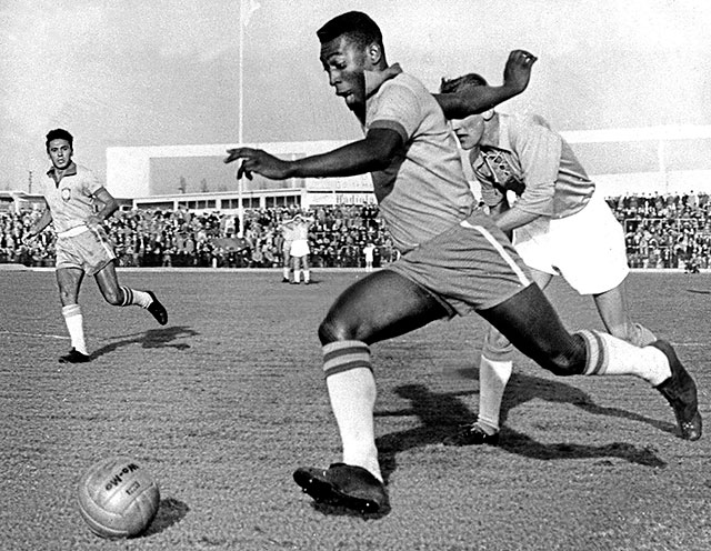 A photo of Pele dribbling the ball during a match