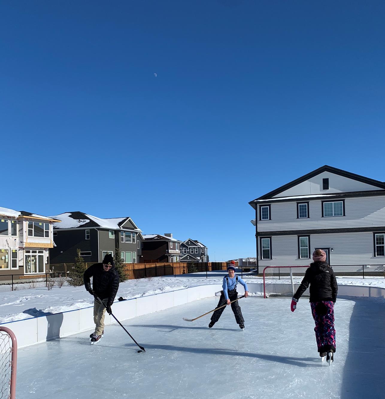 Kinniburgh South residents playing ice hockey
