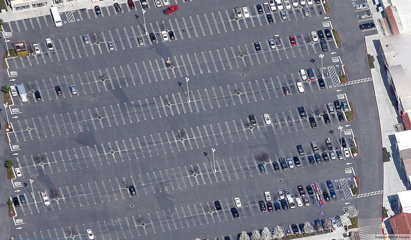 Aerial view of a parking lot

Description automatically generated