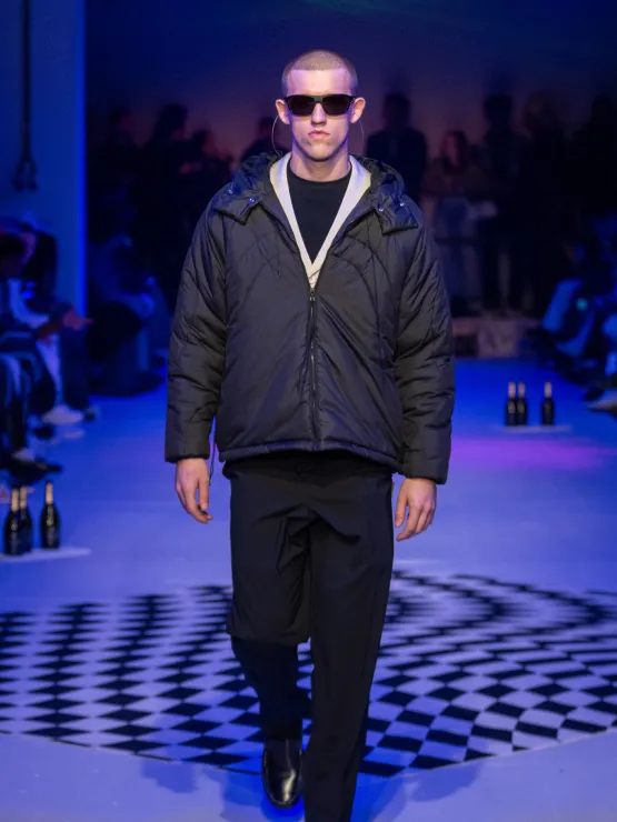 Picture showing a  model dressed in bomber Jackets and shades for Saul Nash