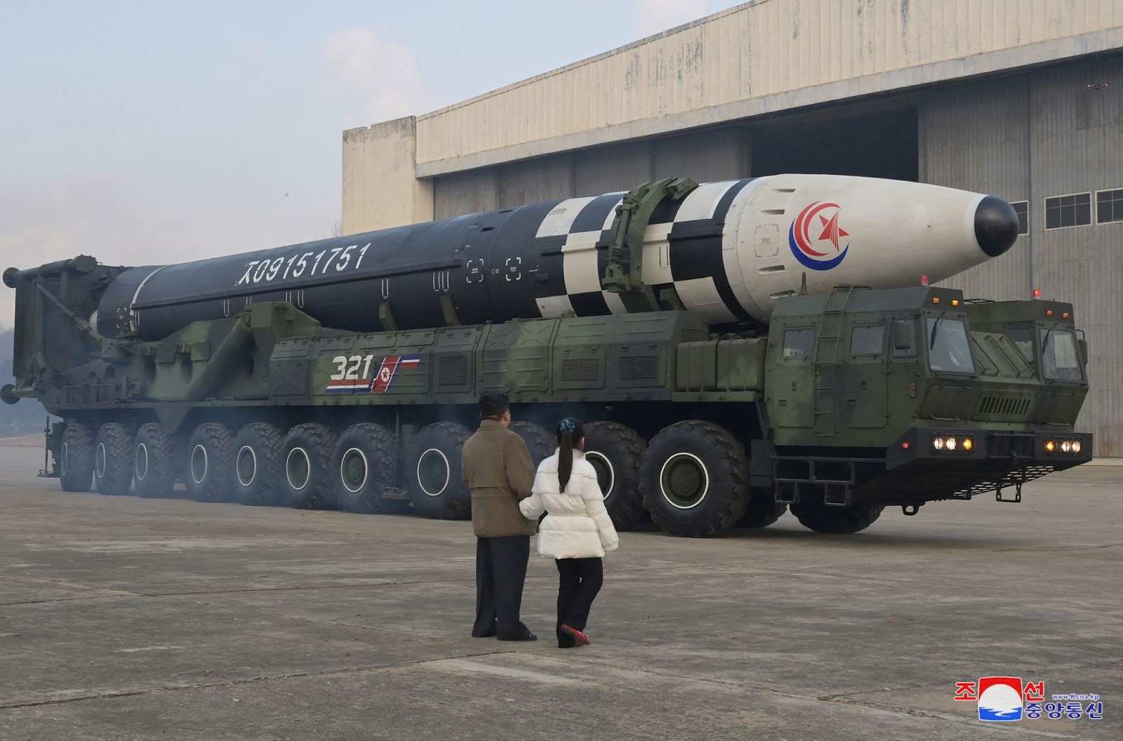 Kim Jong Un in front of a north Korean Ballistic missile