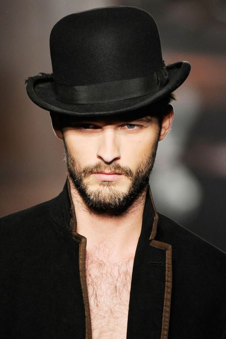 Full picture of a man wearing the bowler hat