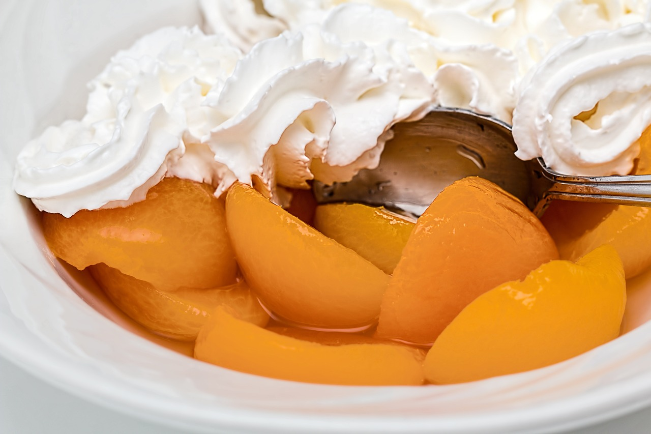 canned peached with whipped cream