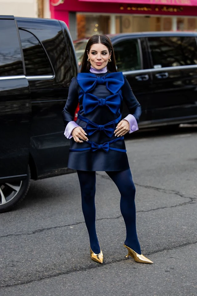 Paris Haute Couture Week 2024: Picture of an attendee rocking a a beautiful top with bow designs and  stockings to match