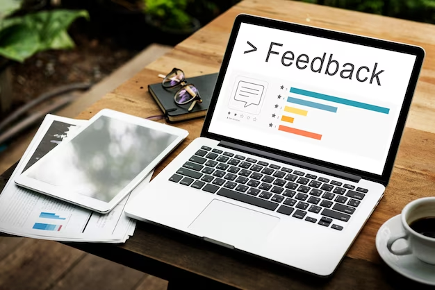 A laptop  showing customer feedback to decrease SaaS churn. 