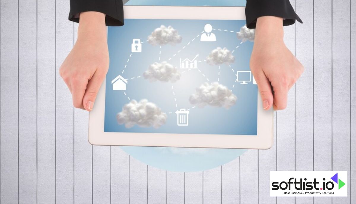 A person holding a tablet featuring cloud icons, utilizing cloud-based warehouse management technology.