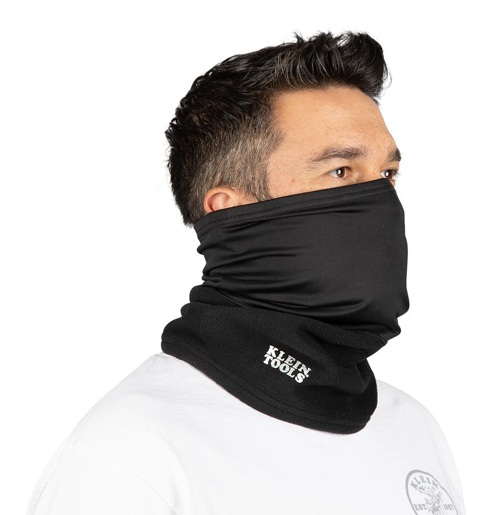A person wearing a black scarf over his face

Description automatically generated