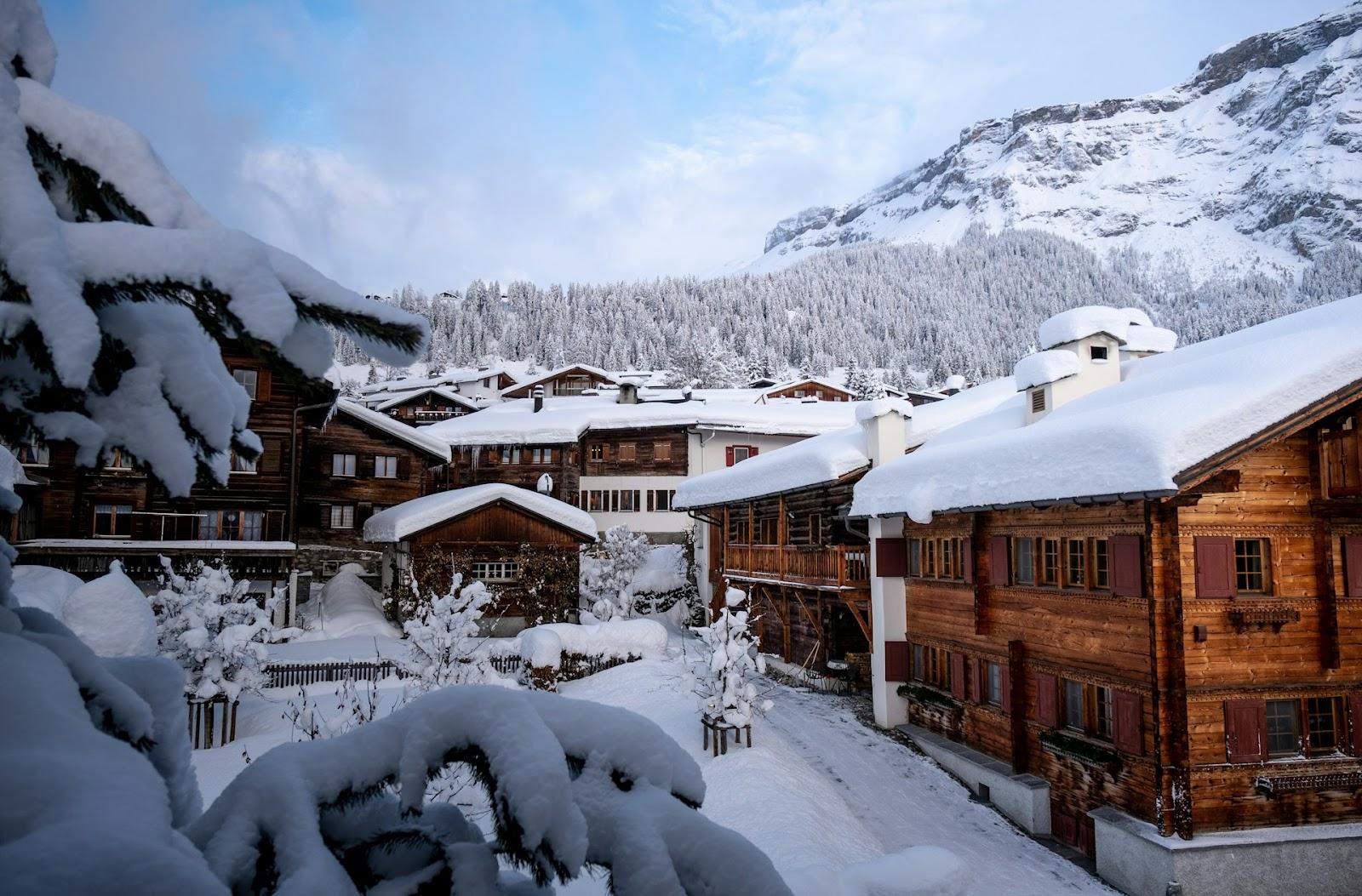 mountain chalets covered in snow