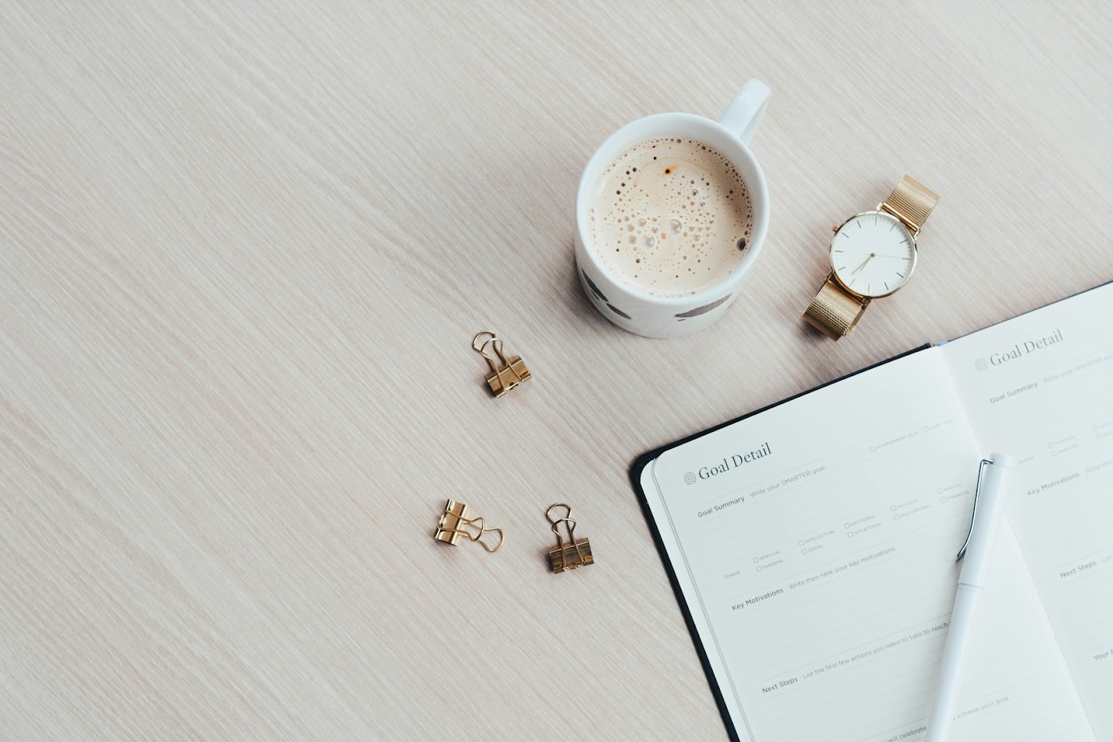 A cup of coffee and a notebook