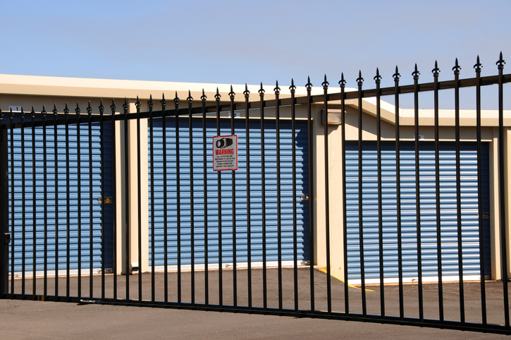 A storage unit facility secured with full perimeter fencing.