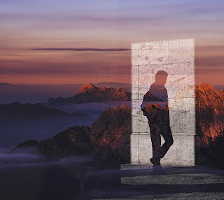 Two images combined in one, using a male shadow and a mountain landscape