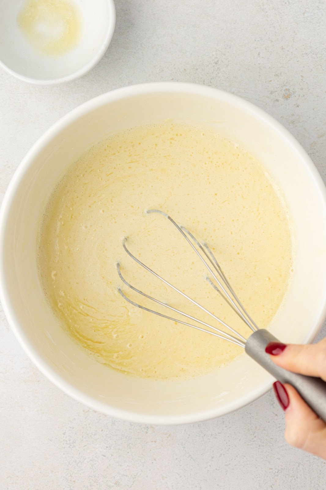 bowl of pancake batter with a whisk