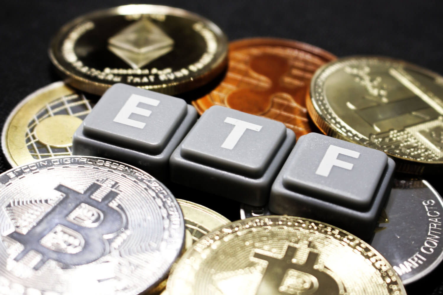 etf scrabble pieces amid crypto coins