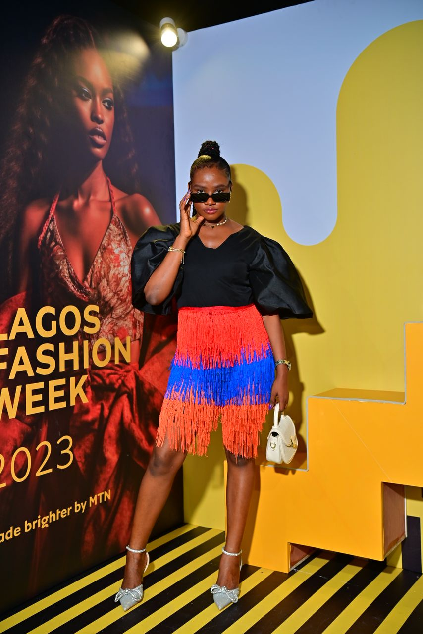Victoria Willie wearing a fringed plasuit from Ria Kosher at Lagos Fashion Week 2023