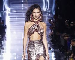 Image of model in a sequined dress on the runway
