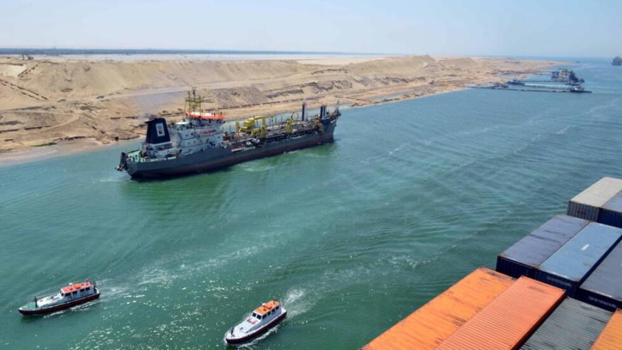A cargo ship is seen crossing through the New Suez Canal, Ismailia, Egypt, July 25, 2015