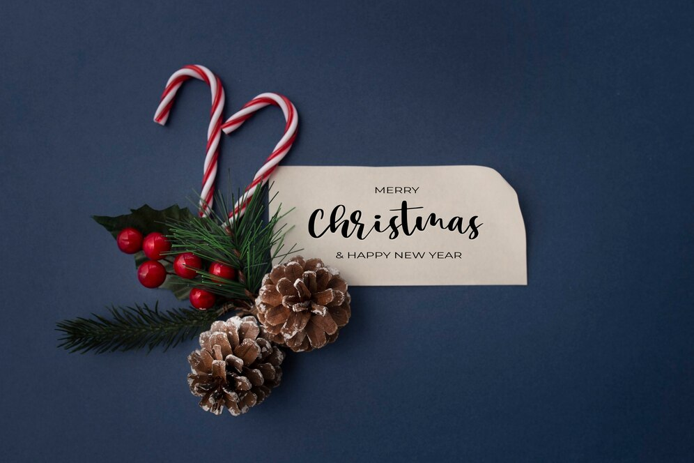 A Christmas card alongside ornaments.