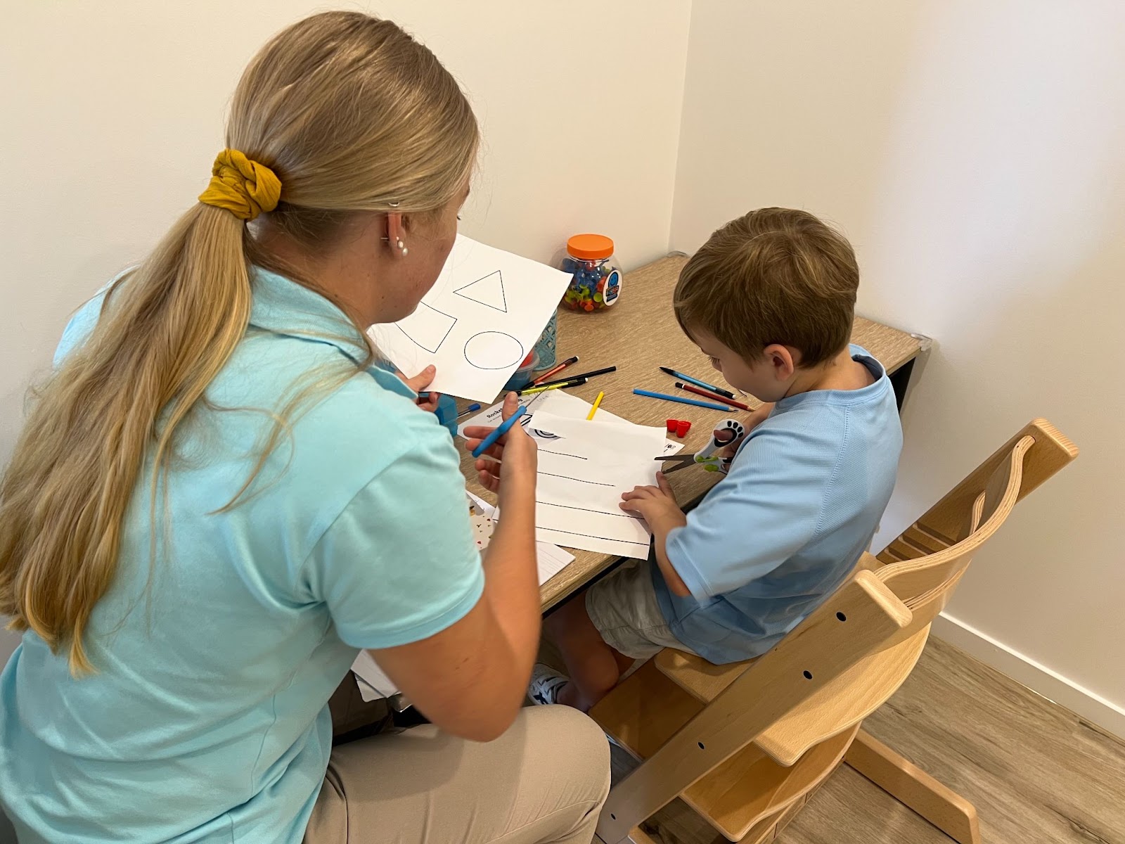 child learning how to use scissors