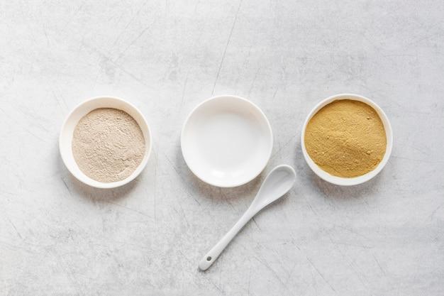 Flat lay sand in bowls and spoon