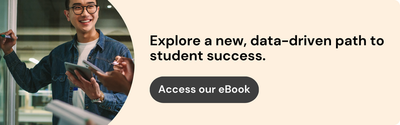 On the left, an image of a person smiling happily while writing notes on a whiteboard, tablet in hand. On the right, the text reads "Explore a new, data-driven path to student success. Access our eBook."