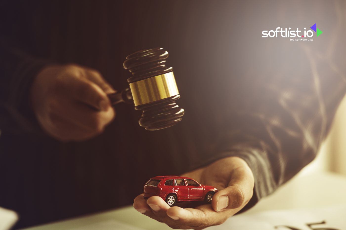 Hand with gavel and toy car