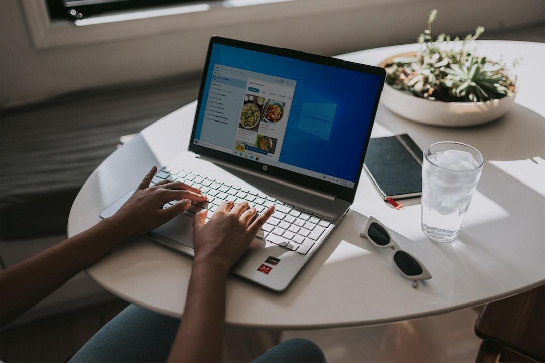 A woman types on her computer.