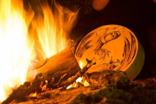 Shamanic tambourine Shamanic leather tambourine with animals drawings in front of a bonfire  the Art of Primitive Fire Making stock pictures, royalty-free photos & images