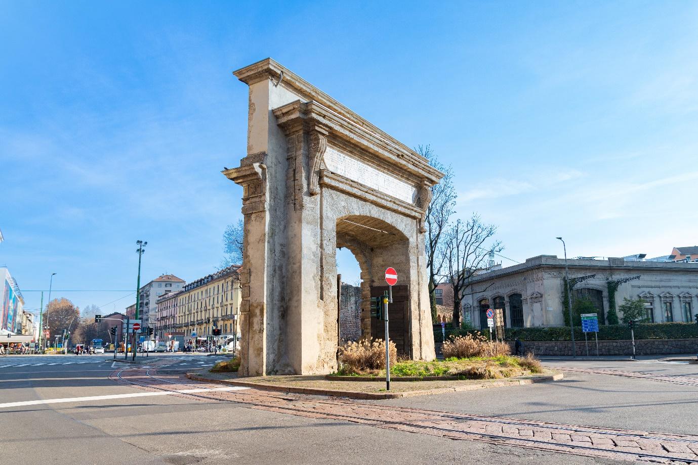 A stone archway in a city

Description automatically generated